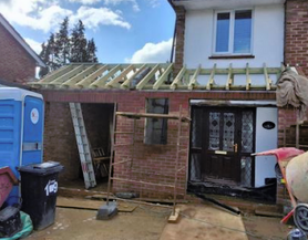 New garage into motorcycle workshop and front porch extension Project image