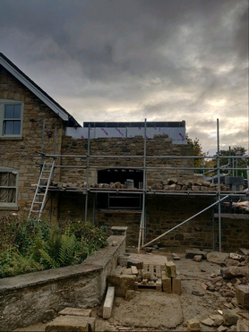 2 story stone extension Project image