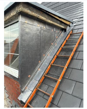 Complete new slate roof to a school  Project image
