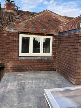 new build vertical tile hanging, pitched roof and PVC membrane flat roof Project image