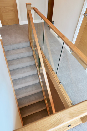 Oak and Glass Staircase  with Bullnose Feature Step Project image