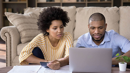 iStock couple laptop calculator 500px