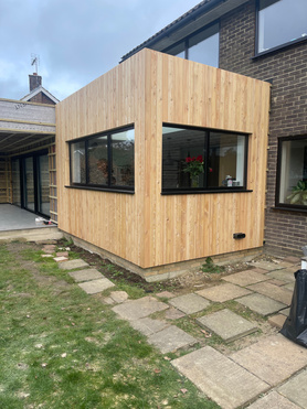 Larch Cladding to main house and extension.  Project image