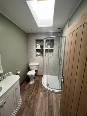 Transformative Bathroom Renovation Overcomes Plumbing Challenges: Delights Client and Family Project image