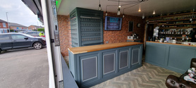 vape shop counter paneling and hanging slat wall  Project image