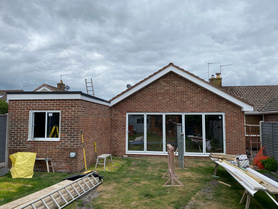 Single Storey Rear Kitchen Extension with dual pitched roof & vaulted ceiling alongside partial garage conversion Project image