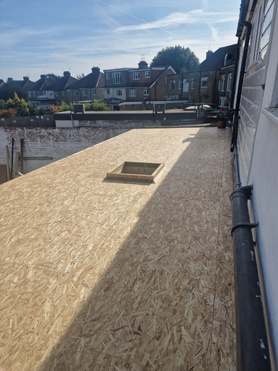 Commercial flat roof at rear of high street shop Project image
