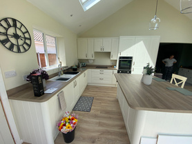 Single Storey Rear Kitchen Extension with dual pitched roof & vaulted ceiling alongside partial garage conversion Project image