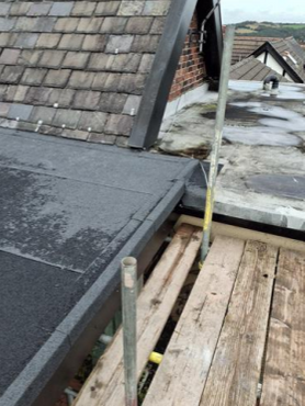 Flat roof. and re-roofing of a pitched roof Project image