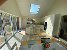 Single Storey Rear Kitchen Extension with dual pitched roof & vaulted ceiling alongside partial garage conversion Project image